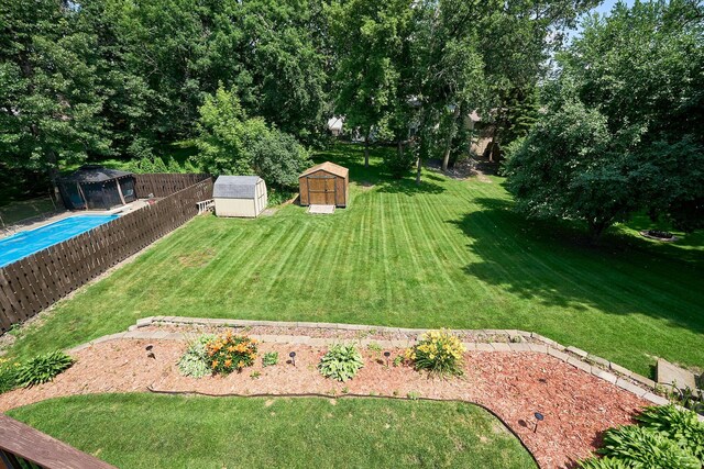 19161 Zane St NW, Elk River, MN 55330 - fenced backyard featuring a storage unit