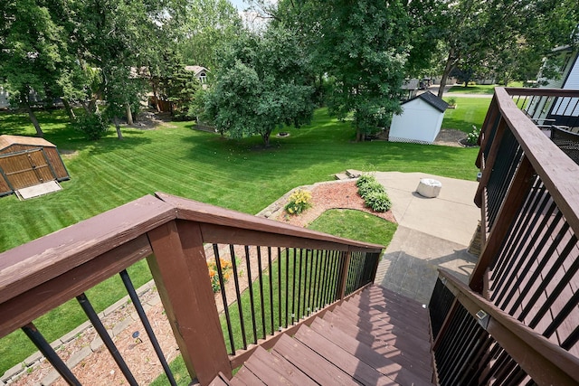 19161 Zane St NW, Elk River, MN 55330 - wooden terrace featuring a storage shed, a lawn, and a patio