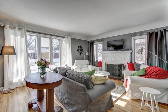 1331 2nd St NW, Rochester, MN 55901 - living room with plenty of natural light, a brick fireplace, and light wood finished floors