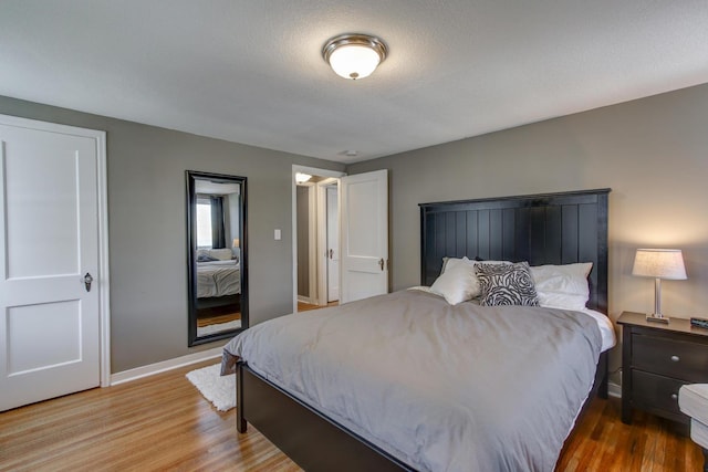 1331 2nd St NW, Rochester, MN 55901 - bedroom with baseboards and wood finished floors