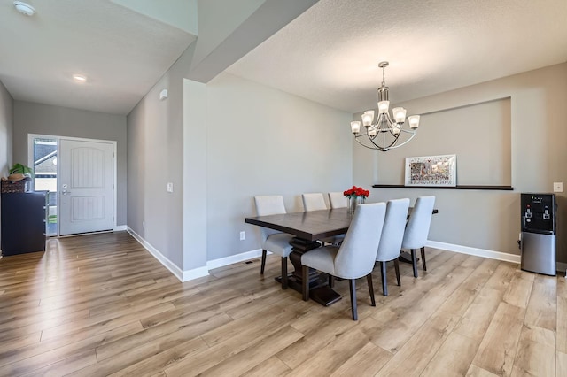 11887 73rd St NE, Otsego, MN 55301 - dining area with light wood-style flooring and a chandelier