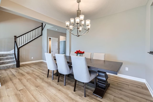 11887 73rd St NE, Otsego, MN 55301 - dining space with stairs, a chandelier, and light wood-type flooring