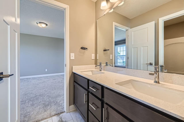 11887 73rd St NE, Otsego, MN 55301 - bathroom featuring double vanity and marble look tile flooring