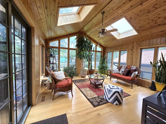 2108 74th Ave N, Brooklyn Park, MN 55444 - living area featuring a skylight, wooden ceiling, wood finished floors, wooden walls, and high vaulted ceiling