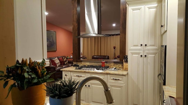2108 74th Ave N, Brooklyn Park, MN 55444 - kitchen with wall chimney range hood, stainless steel gas cooktop, lofted ceiling, and light stone countertops