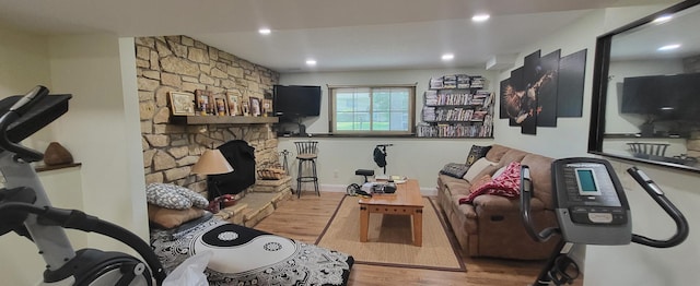 2108 74th Ave N, Brooklyn Park, MN 55444 - living area featuring wood finished floors, a stone fireplace, and recessed lighting