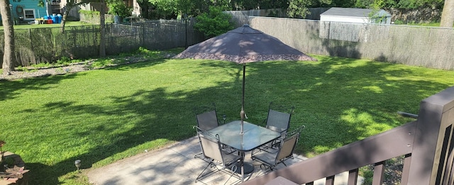 2108 74th Ave N, Brooklyn Park, MN 55444 - fenced backyard featuring a patio and outdoor dining area
