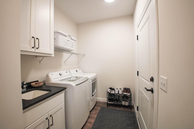 1267 Naser Way, New Richmond, WI 54017 - washroom with independent washer and dryer, dark wood-style floors, and cabinet space