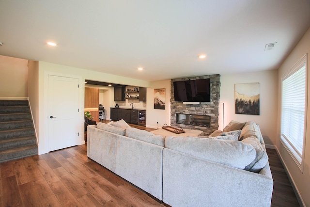 1267 Naser Way, New Richmond, WI 54017 - living area with stairway, beverage cooler, dark wood-style floors, plenty of natural light, and recessed lighting
