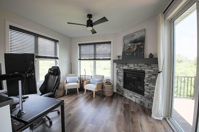 1267 Naser Way, New Richmond, WI 54017 - home office with ceiling fan, a fireplace, and wood finished floors
