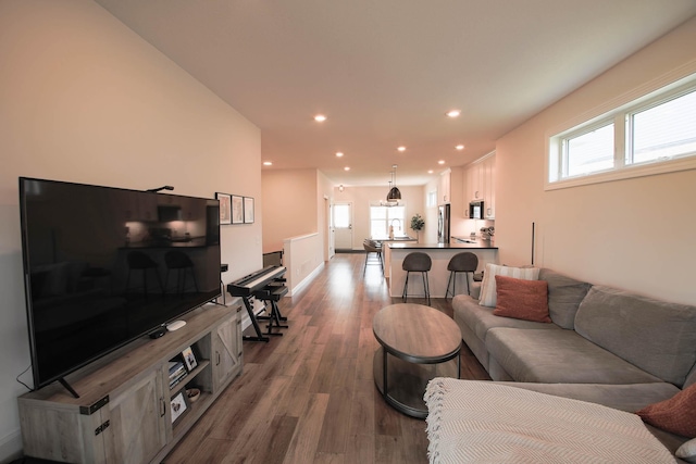 1267 Naser Way, New Richmond, WI 54017 - living room featuring dark wood finished floors, healthy amount of natural light, and recessed lighting