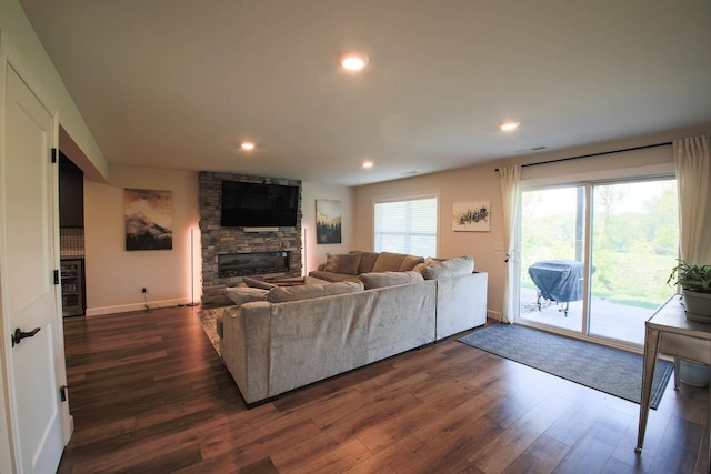 1267 Naser Way, New Richmond, WI 54017 - living area with dark wood-type flooring, a stone fireplace, recessed lighting, and beverage cooler