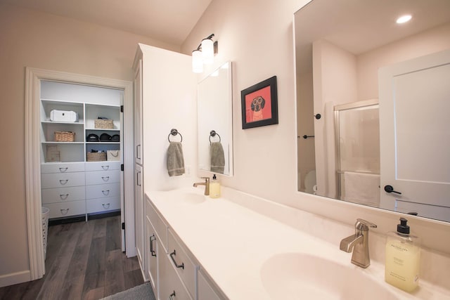 1267 Naser Way, New Richmond, WI 54017 - bathroom with wood finished floors, double vanity, a shower with door, and recessed lighting
