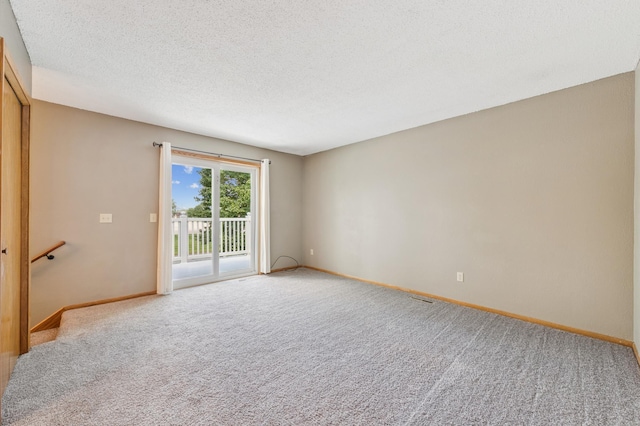 510 78th Ave NE, Spring Lake Park, MN 55432 - spare room with light colored carpet and a textured ceiling