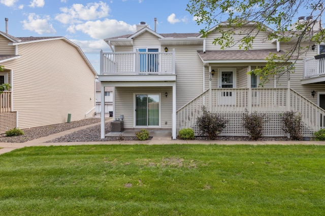 510 78th Ave NE, Spring Lake Park, MN 55432 - view of front of house with a front yard, a chimney, roof with shingles, and a balcony