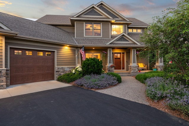 1899 White Oak Dr, Chaska, MN 55318 - craftsman house featuring stone siding, roof with shingles, asphalt driveway, and a garage