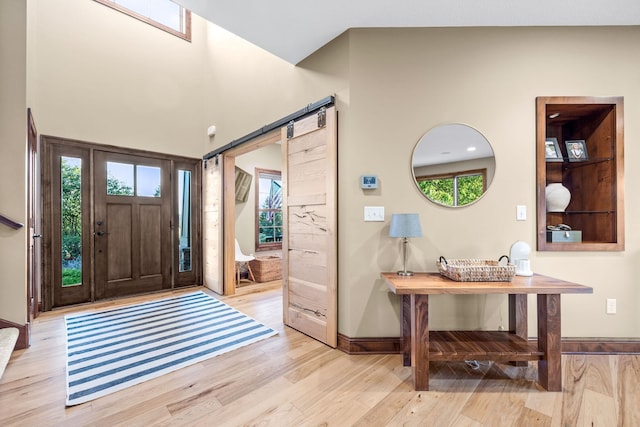 1899 White Oak Dr, Chaska, MN 55318 - entrance foyer with light wood finished floors and a barn door