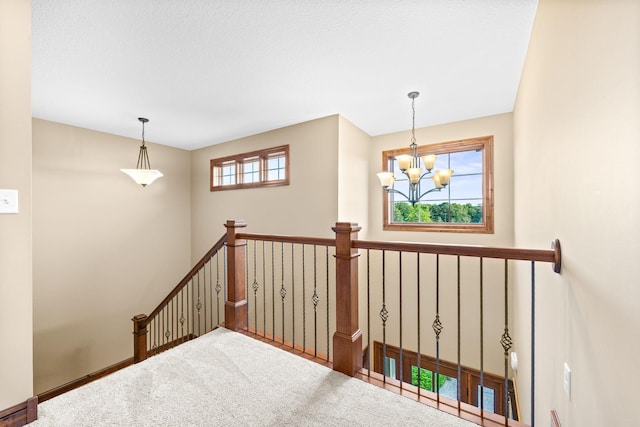 1899 White Oak Dr, Chaska, MN 55318 - staircase with a chandelier and carpet floors