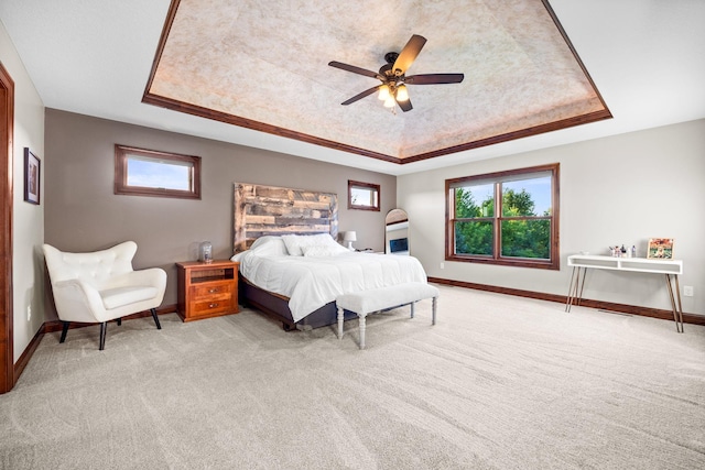 1899 White Oak Dr, Chaska, MN 55318 - bedroom featuring a tray ceiling, light colored carpet, and multiple windows