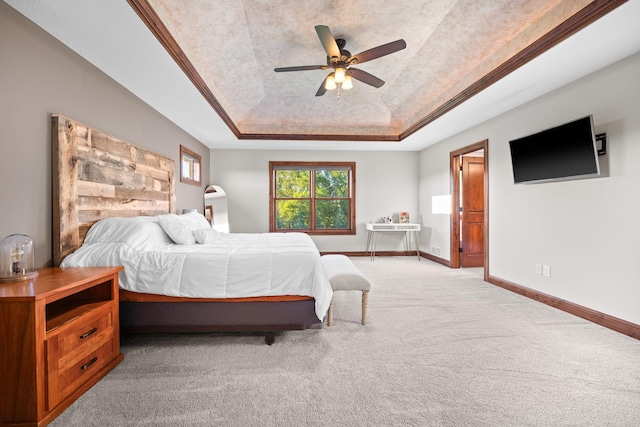 1899 White Oak Dr, Chaska, MN 55318 - bedroom with a raised ceiling, light colored carpet, and a ceiling fan
