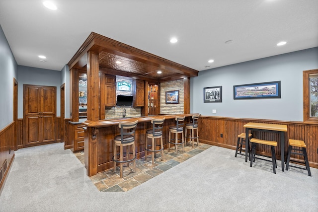 1899 White Oak Dr, Chaska, MN 55318 - indoor wet bar featuring a wainscoted wall, light carpet, recessed lighting, and wood walls