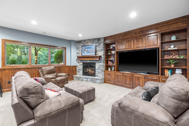 1899 White Oak Dr, Chaska, MN 55318 - living room with light carpet, wood walls, a wainscoted wall, recessed lighting, and a stone fireplace