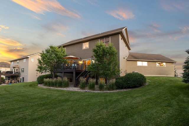 1899 White Oak Dr, Chaska, MN 55318 - back of property at dusk featuring a deck and a yard