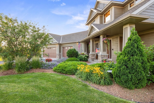 1899 White Oak Dr, Chaska, MN 55318 - view of home's exterior with an attached garage, a lawn, a shingled roof, and a porch