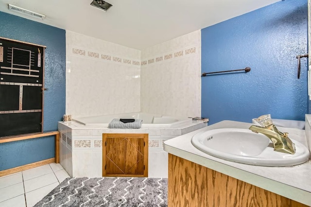 7236 Clear Rdg, Centerville, MN 55038 - bathroom with a garden tub, tile patterned floors, vanity, and a textured wall