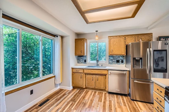 7236 Clear Rdg, Centerville, MN 55038 - kitchen with appliances with stainless steel finishes, light countertops, plenty of natural light, and backsplash
