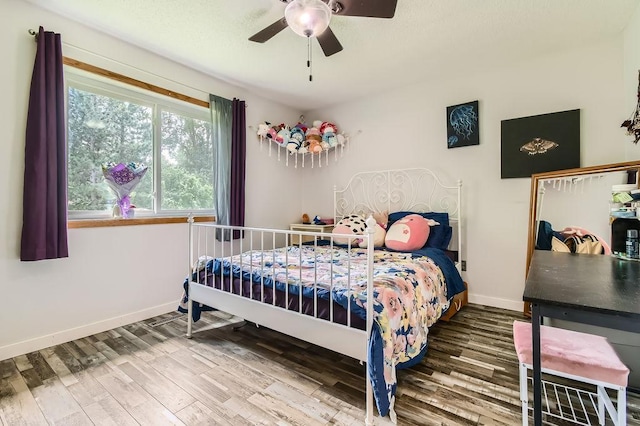 7236 Clear Rdg, Centerville, MN 55038 - bedroom featuring wood finished floors and a ceiling fan