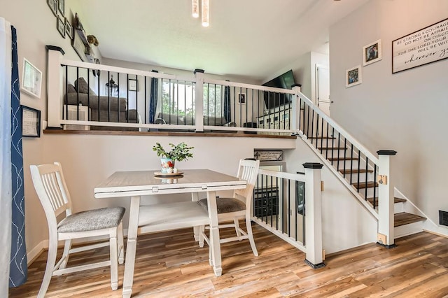 7236 Clear Rdg, Centerville, MN 55038 - dining room featuring wood finished floors and stairway
