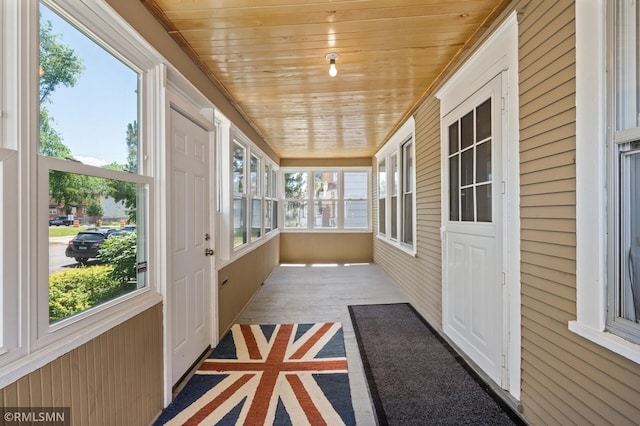 727 Virginia St, Saint Paul, MN 55103 - unfurnished sunroom featuring wooden ceiling, wood finished floors, and wooden walls