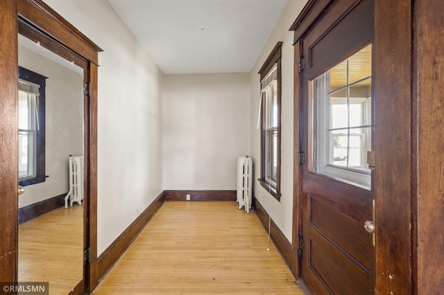 727 Virginia St, Saint Paul, MN 55103 - hall with radiator and light wood finished floors