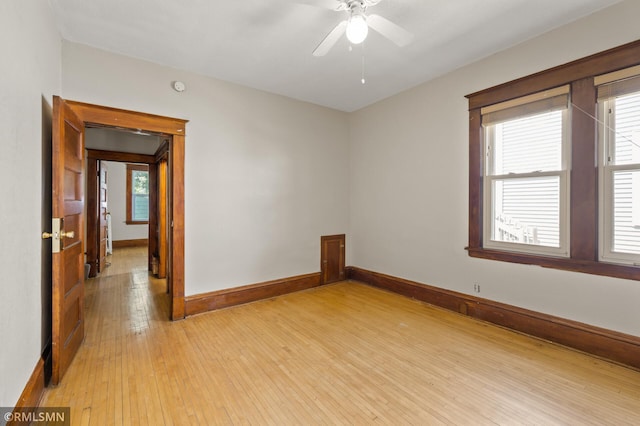 727 Virginia St, Saint Paul, MN 55103 - unfurnished room featuring light wood-style flooring, a ceiling fan, and a smoke detector