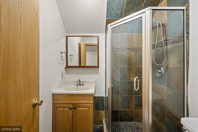 727 Virginia St, Saint Paul, MN 55103 - full bath with vanity, a shower stall, and a textured ceiling