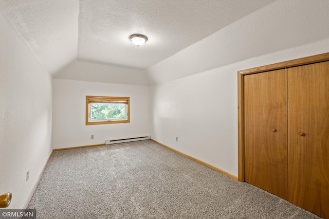 727 Virginia St, Saint Paul, MN 55103 - additional living space featuring a baseboard radiator, carpet, lofted ceiling, and a textured ceiling