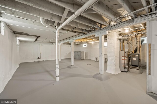727 Virginia St, Saint Paul, MN 55103 - unfinished below grade area featuring gas water heater and heating unit