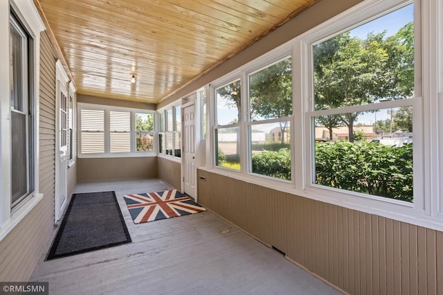 727 Virginia St, Saint Paul, MN 55103 - unfurnished sunroom featuring wooden walls and wood finished floors