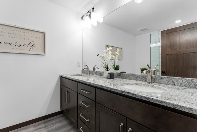 12910 Brenly Way, Rogers, MN 55374 - full bath with double vanity and wood finished floors