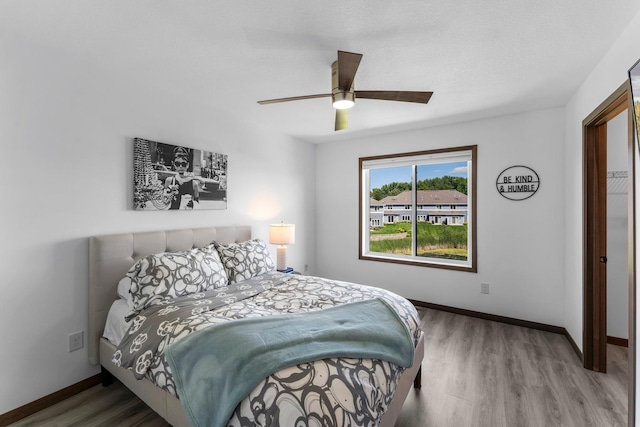 12910 Brenly Way, Rogers, MN 55374 - bedroom with wood finished floors and a ceiling fan