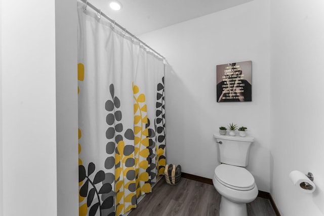 12910 Brenly Way, Rogers, MN 55374 - bathroom featuring wood finished floors and a shower with shower curtain