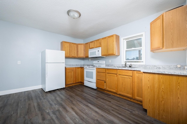 213 Caledonia St, Caledonia, MN 55921 - kitchen featuring white appliances, dark wood finished floors, light countertops, and a textured ceiling