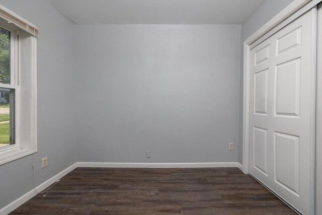 213 Caledonia St, Caledonia, MN 55921 - spare room featuring dark wood finished floors and baseboards