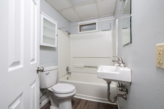 213 Caledonia St, Caledonia, MN 55921 - full bathroom featuring a paneled ceiling, wood finished floors, and bathtub / shower combination