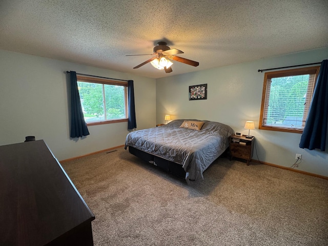 1070 20th St NE, Owatonna, MN 55060 - carpeted bedroom with a textured ceiling and ceiling fan