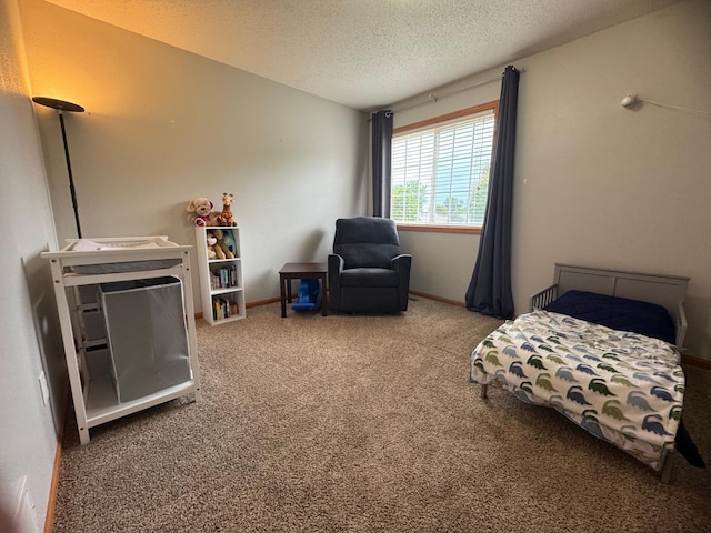 1070 20th St NE, Owatonna, MN 55060 - carpeted bedroom featuring a textured ceiling and baseboards