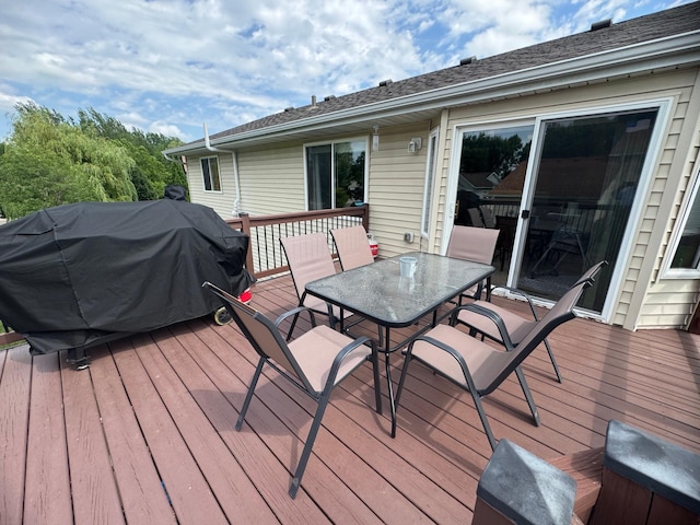 1070 20th St NE, Owatonna, MN 55060 - deck featuring outdoor dining area and grilling area