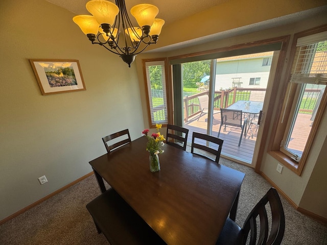 1070 20th St NE, Owatonna, MN 55060 - dining room featuring a chandelier and carpet