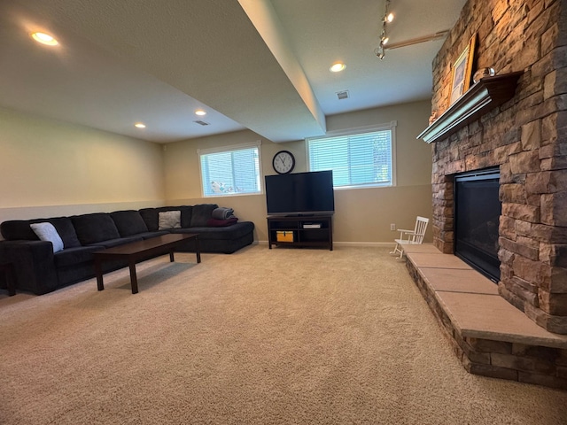 1070 20th St NE, Owatonna, MN 55060 - living room with carpet flooring, a fireplace, and recessed lighting